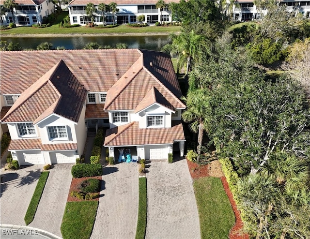 drone / aerial view with a water view and a residential view
