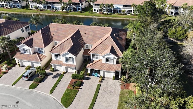 bird's eye view featuring a water view and a residential view