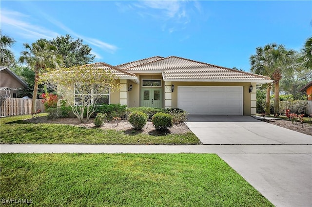 view of front facade with driveway, an attached garage, fence, and stucco siding