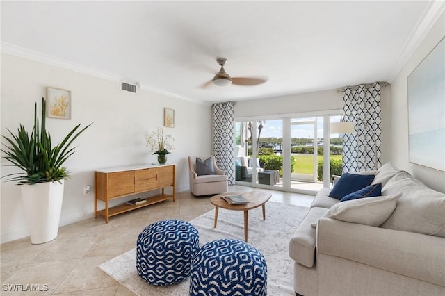 living room with ceiling fan, baseboards, visible vents, and crown molding