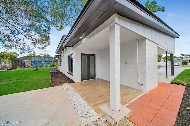 exterior space with glass enclosure and central AC unit