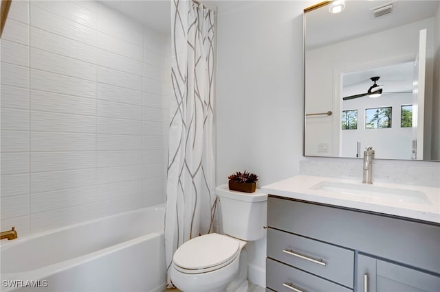 bathroom with toilet, visible vents, a ceiling fan, vanity, and shower / bathtub combination with curtain