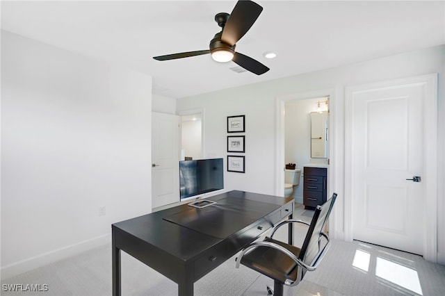 office area featuring baseboards and a ceiling fan