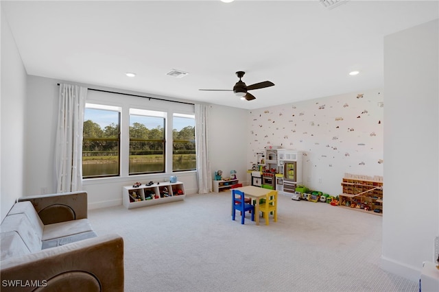 playroom with carpet floors, wallpapered walls, baseboards, and visible vents