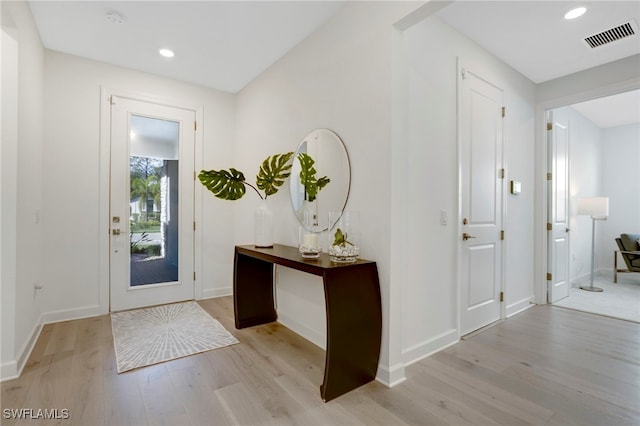 entryway featuring baseboards, recessed lighting, visible vents, and light wood-style floors