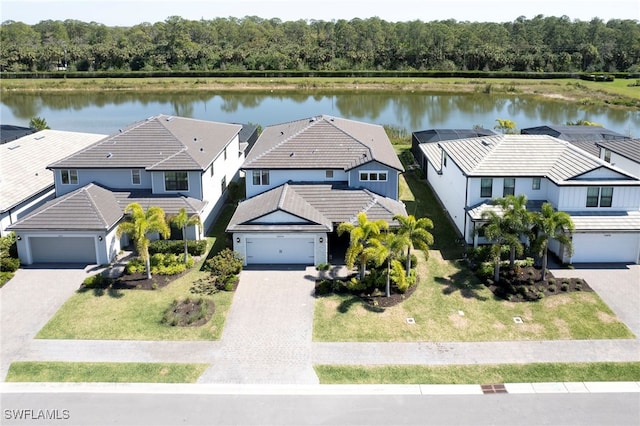 bird's eye view with a residential view and a water view