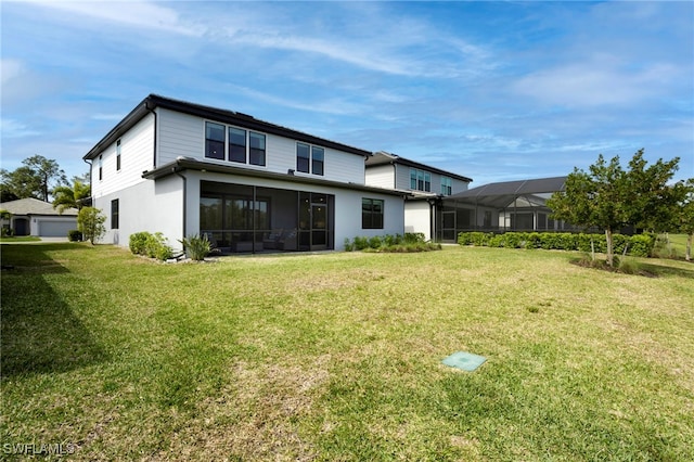 rear view of house with a yard