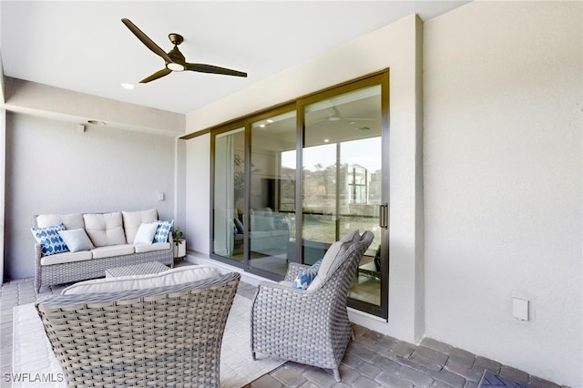 view of patio with outdoor lounge area and a ceiling fan