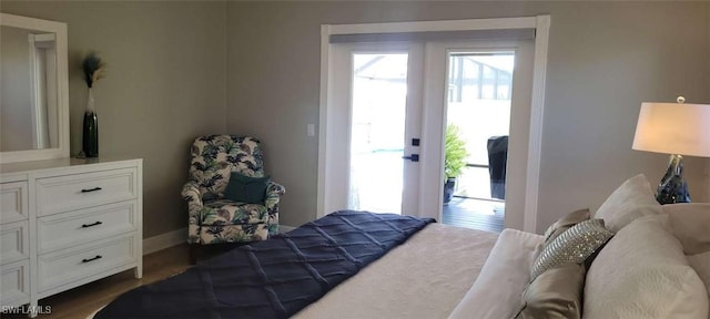 bedroom with baseboards and dark wood-type flooring