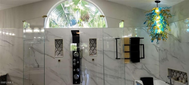 interior space featuring a marble finish shower