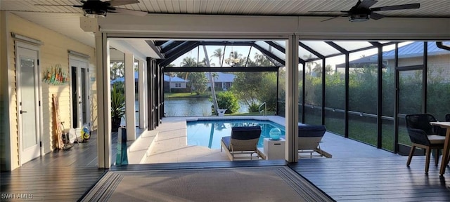 pool with a lanai and ceiling fan