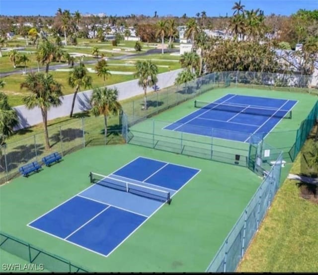 view of sport court with fence