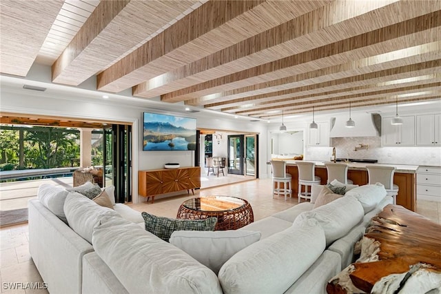 living room with wooden ceiling and beam ceiling
