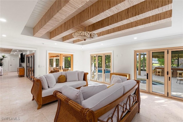 living area with ornamental molding, a tray ceiling, french doors, and recessed lighting