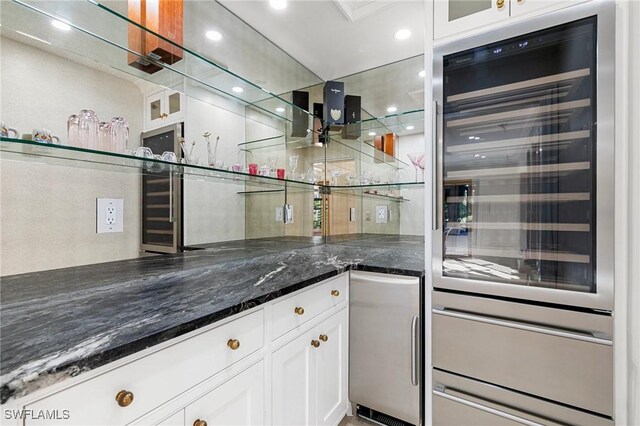 bar with beverage cooler, bar area, a warming drawer, and recessed lighting