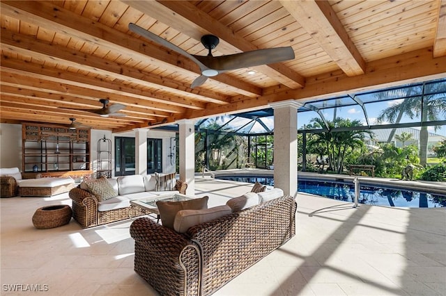 view of patio / terrace with a lanai, ceiling fan, an outdoor pool, and an outdoor hangout area