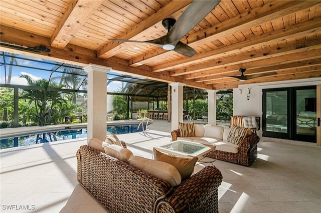 view of patio / terrace with an outdoor living space with a fire pit, glass enclosure, an outdoor pool, and ceiling fan