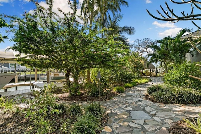 surrounding community with a boat dock
