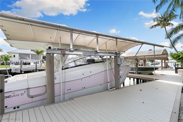 view of dock with a water view and boat lift