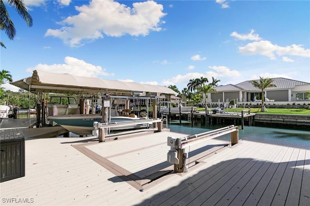 view of dock with a water view and boat lift