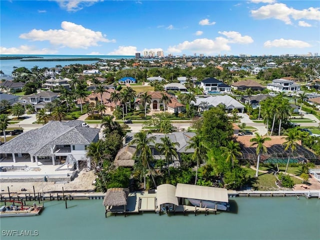 birds eye view of property featuring a water view and a residential view