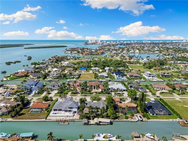 bird's eye view with a water view and a residential view