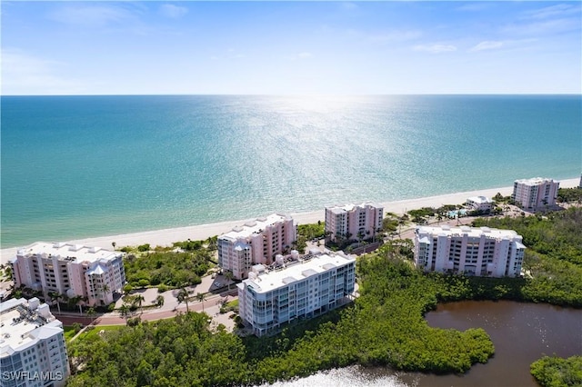 bird's eye view with a beach view, a view of city, and a water view