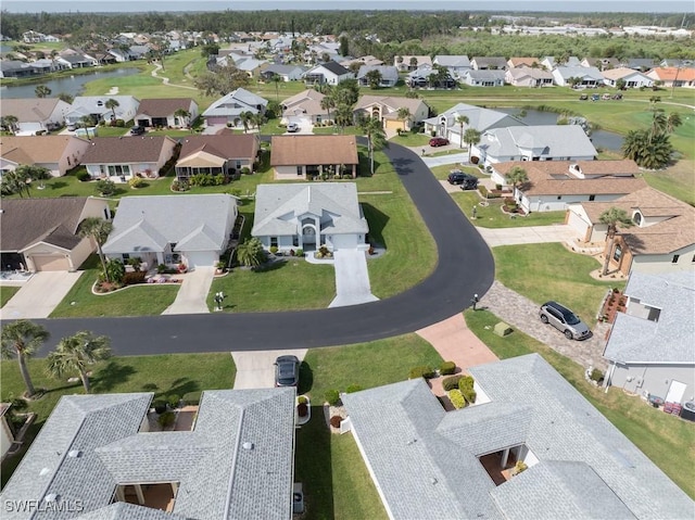 aerial view featuring a water view and a residential view