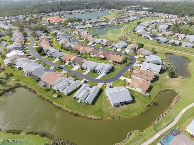 aerial view featuring a residential view and a water view