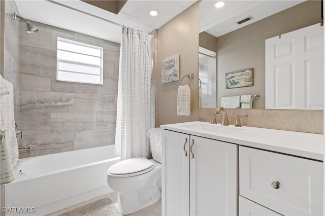 bathroom featuring toilet, recessed lighting, vanity, visible vents, and shower / tub combo with curtain