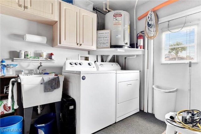 laundry area featuring washer and clothes dryer, cabinet space, water heater, carpet flooring, and a sink