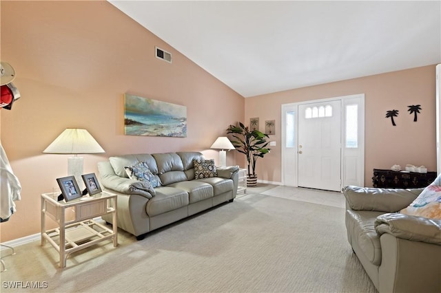 living area featuring carpet floors, high vaulted ceiling, visible vents, and baseboards