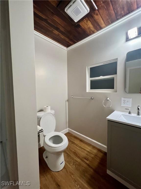 half bath featuring wooden ceiling, toilet, wood finished floors, visible vents, and baseboards