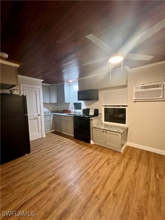 kitchen with black appliances, light wood-type flooring, wood ceiling, and gray cabinetry