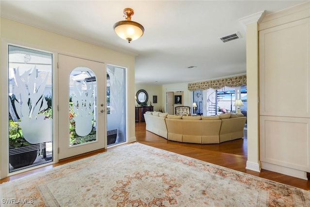 entrance foyer with visible vents and wood finished floors