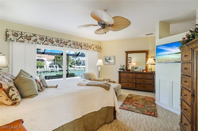 bedroom with light carpet, a ceiling fan, visible vents, and access to exterior