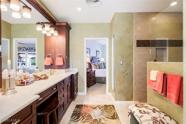 bathroom featuring visible vents, ensuite bathroom, vanity, tile patterned flooring, and walk in shower