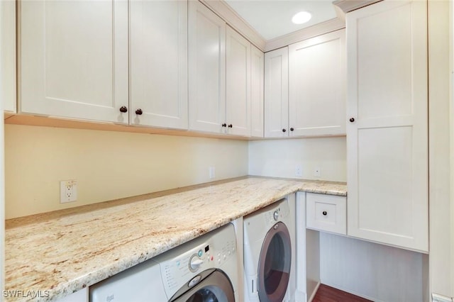 washroom with independent washer and dryer, cabinet space, and recessed lighting