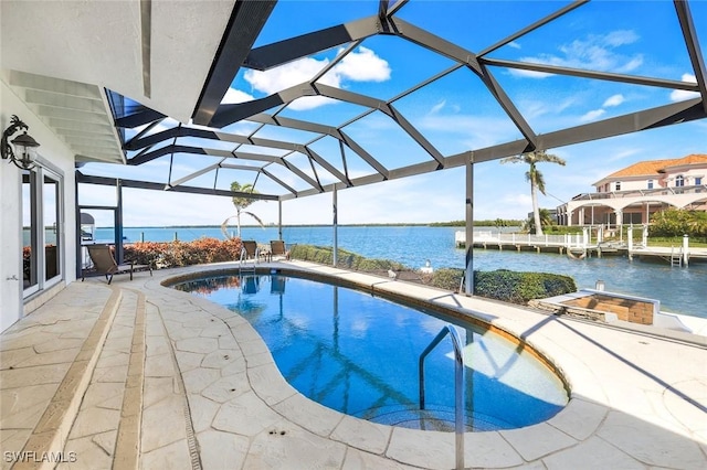 pool with a patio area, a water view, and a lanai