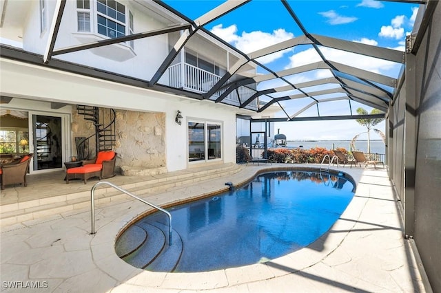 pool featuring a lanai and a patio