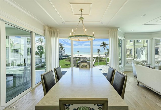 sunroom with an inviting chandelier