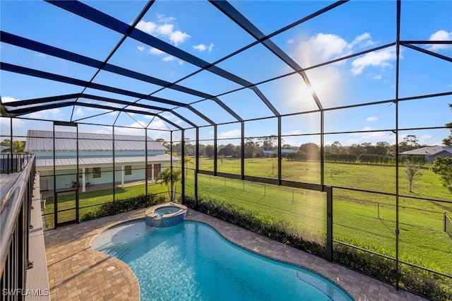 view of pool featuring a rural view, a lanai, a yard, a patio area, and a pool with connected hot tub