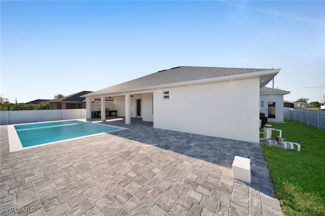 view of pool with a lawn, a patio area, a fenced backyard, and a fenced in pool