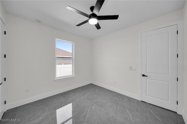 unfurnished bedroom featuring ceiling fan and baseboards