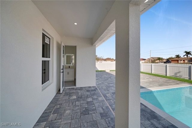 view of patio with a fenced in pool and a fenced backyard