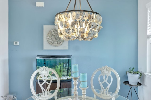 dining area featuring an inviting chandelier