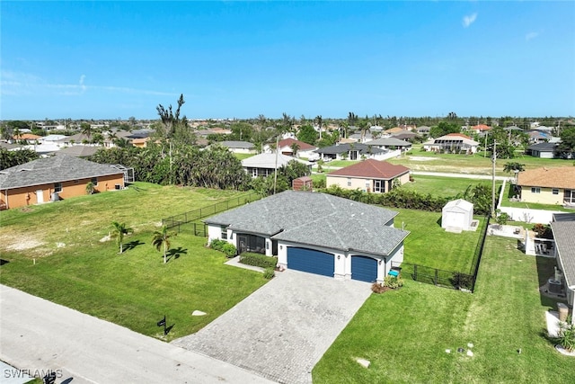 birds eye view of property with a residential view