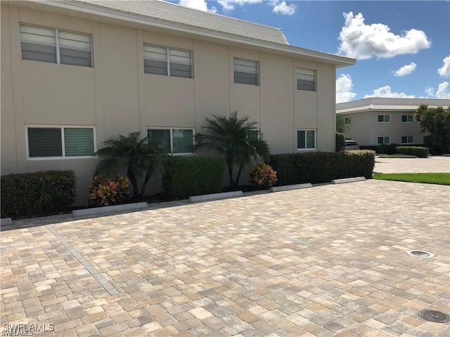 view of side of home featuring stucco siding