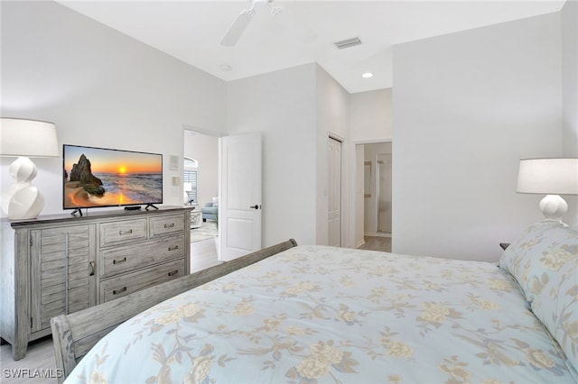 bedroom featuring visible vents, wood finished floors, and ceiling fan