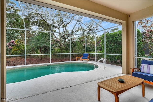 outdoor pool featuring a patio area and a lanai